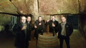 Sampling wine in the catacombs 